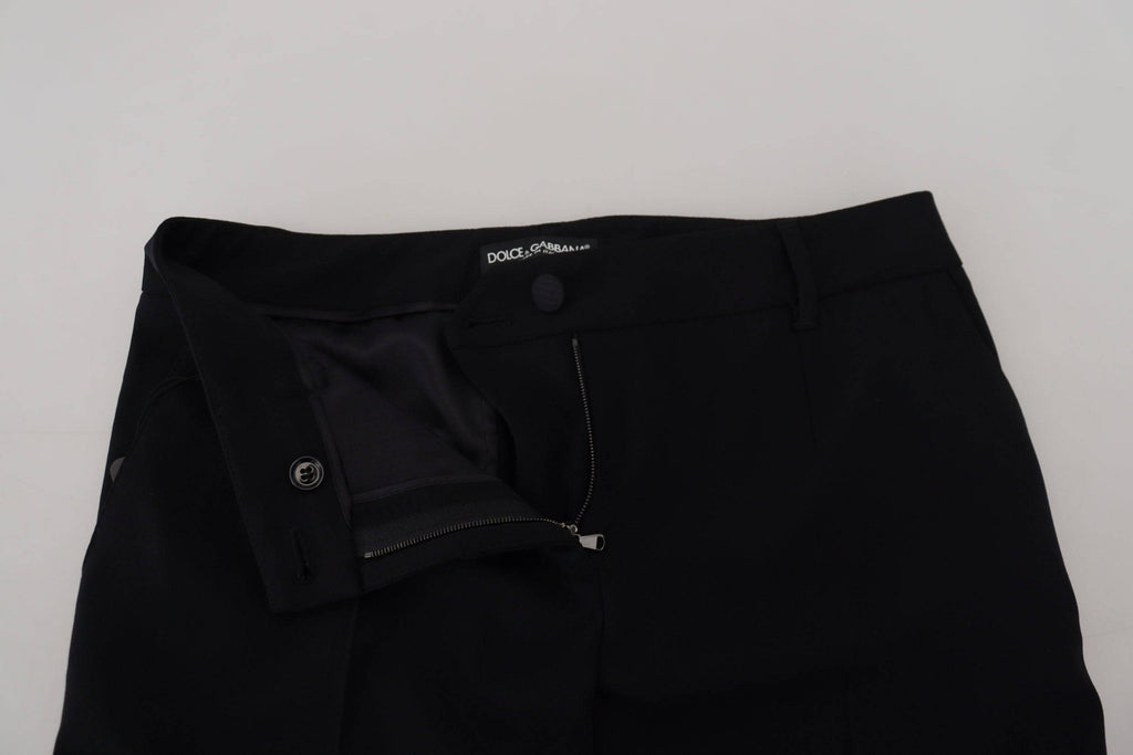Pantalon en laine noire pour femmes de coupe tapered par Dolce & Gabbana, visible avec détails élégants.