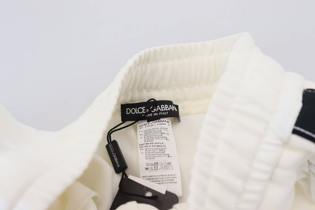 Pantalons de survêtement blancs Dolce & Gabbana DG Logo, style décontracté avec logo visible, tissu confortable et tendance.