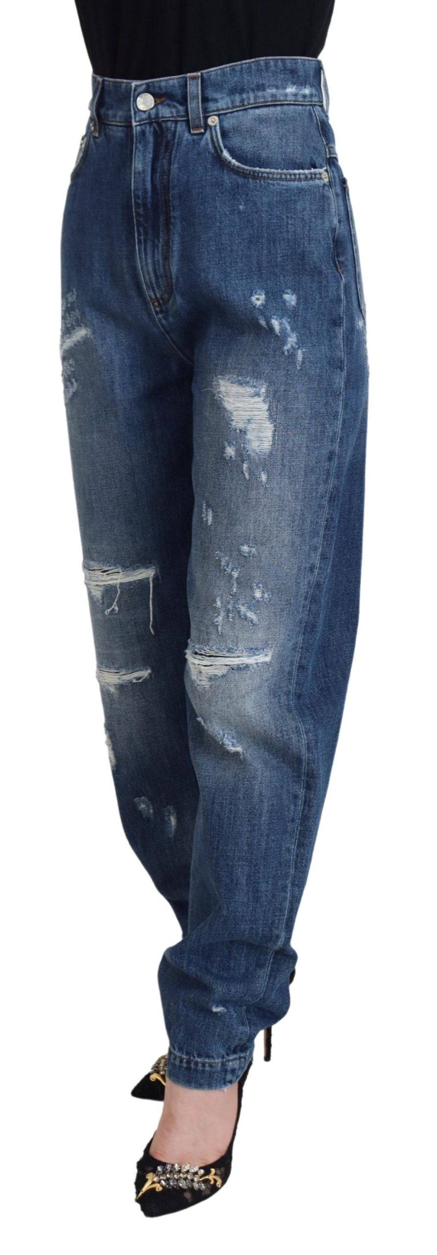 Jeans en denim déchiré en coton bleu délavé de Dolce & Gabbana, vue de face avec détails usés et style décontracté.