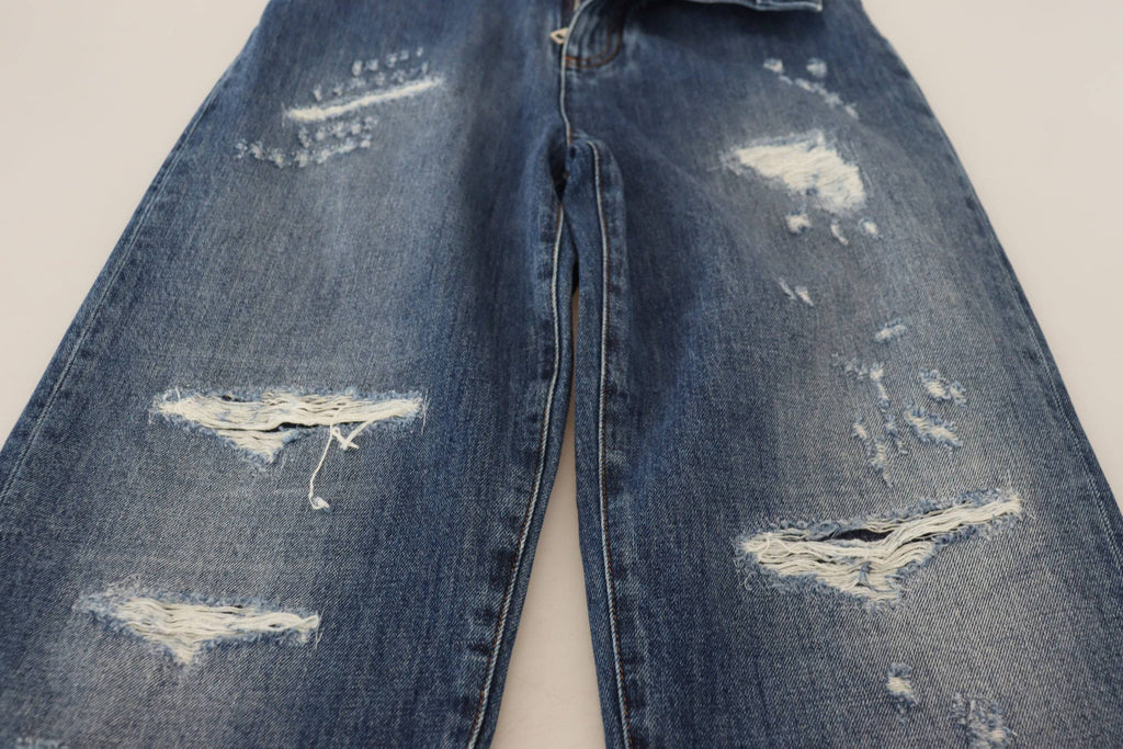 Jeans en denim déchiré en coton lavé bleu de Dolce & Gabbana, style décontracté et tendance.