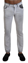 Jeans skinny gris délavé pour homme Dolce & Gabbana, coupe ajustée en denim, visible détail de finition.