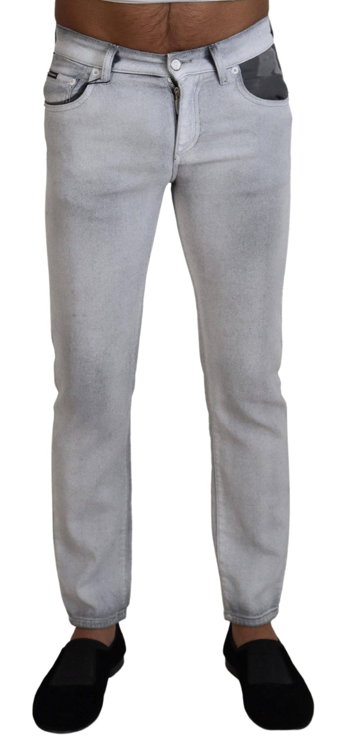 Jeans skinny gris délavé pour homme Dolce & Gabbana, coupe ajustée en denim, visible détail de finition.