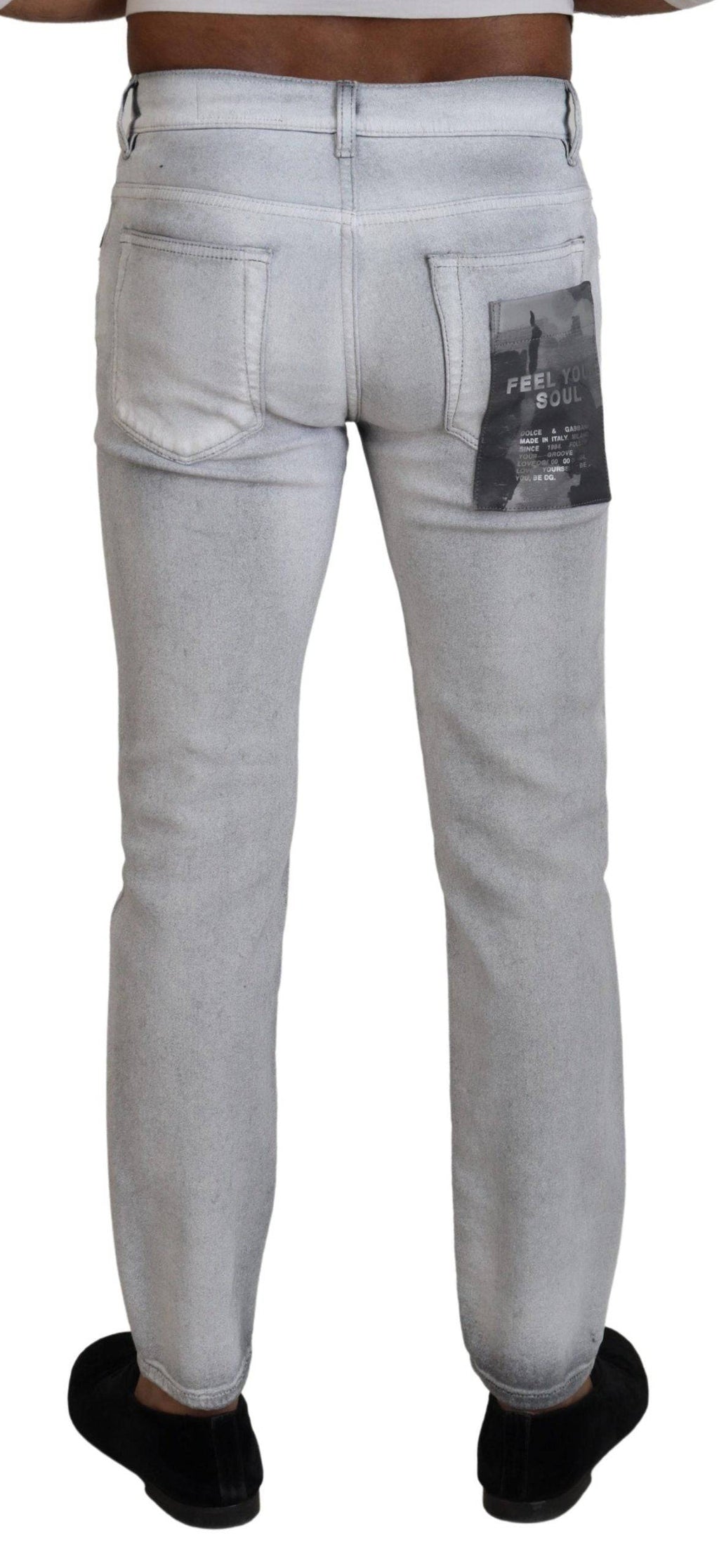 Jeans skinny gris délavé pour homme de Dolce & Gabbana, en denim avec coupe ajustée et détails modernes.