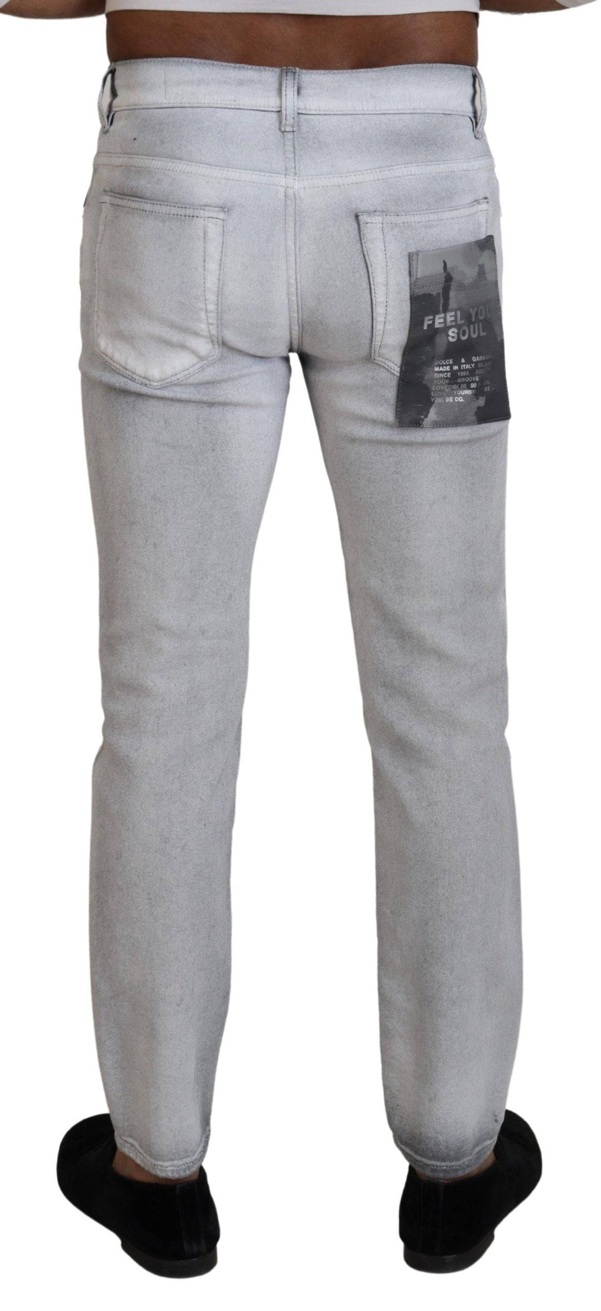 Jeans skinny gris délavé pour homme de Dolce & Gabbana, en denim avec coupe ajustée et détails modernes.