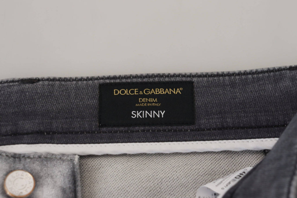 Jeans pour hommes Dolce & Gabbana gris délavé, coupe skinny en denim, visible sur l'image.