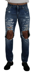 Jeans en denim bleu pour homme de Dolce & Gabbana avec déchirures, en coton, style décontracté et tendance.