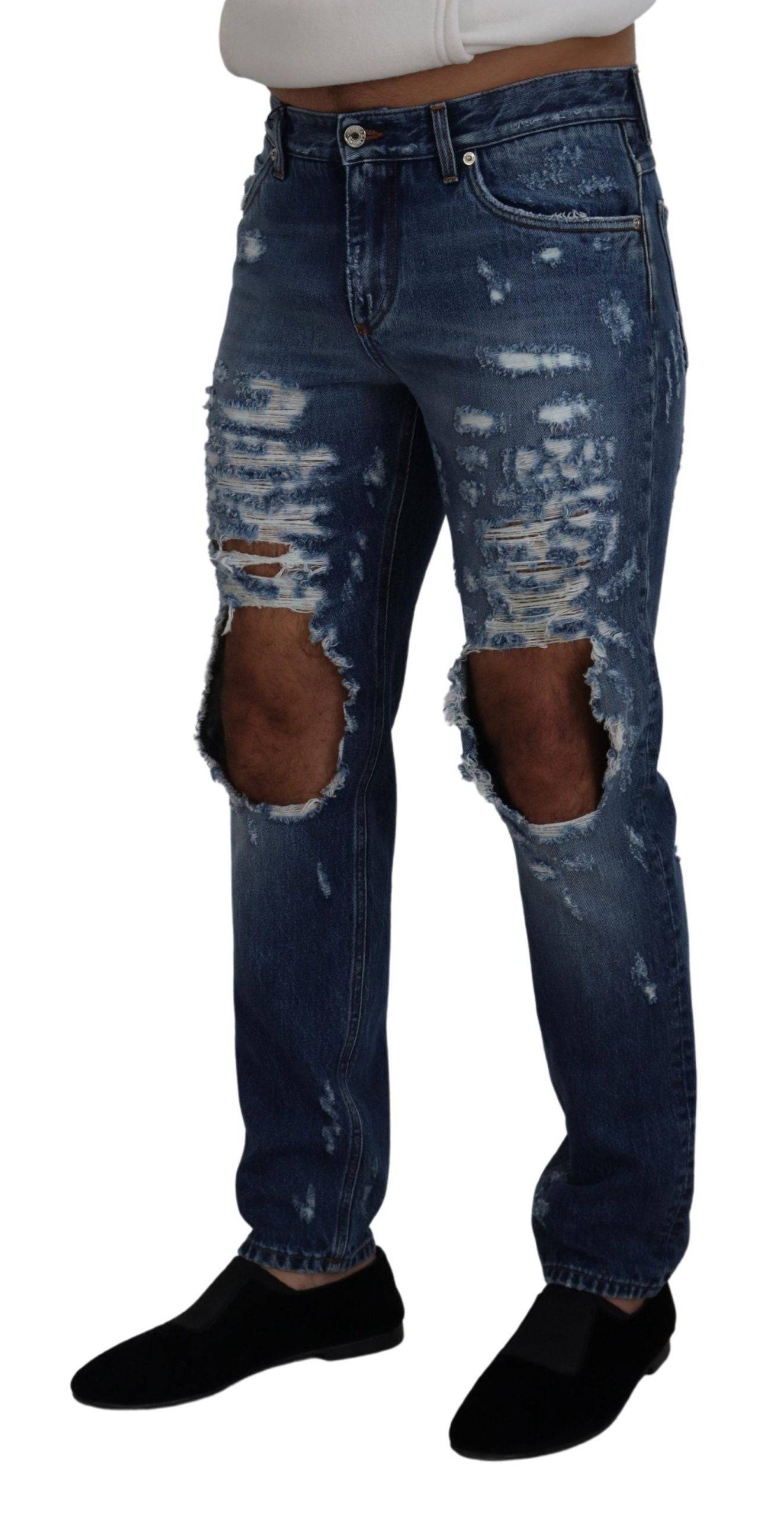 Jeans homme en denim bleu déchiré de Dolce & Gabbana en coton, style décontracté et tendance.