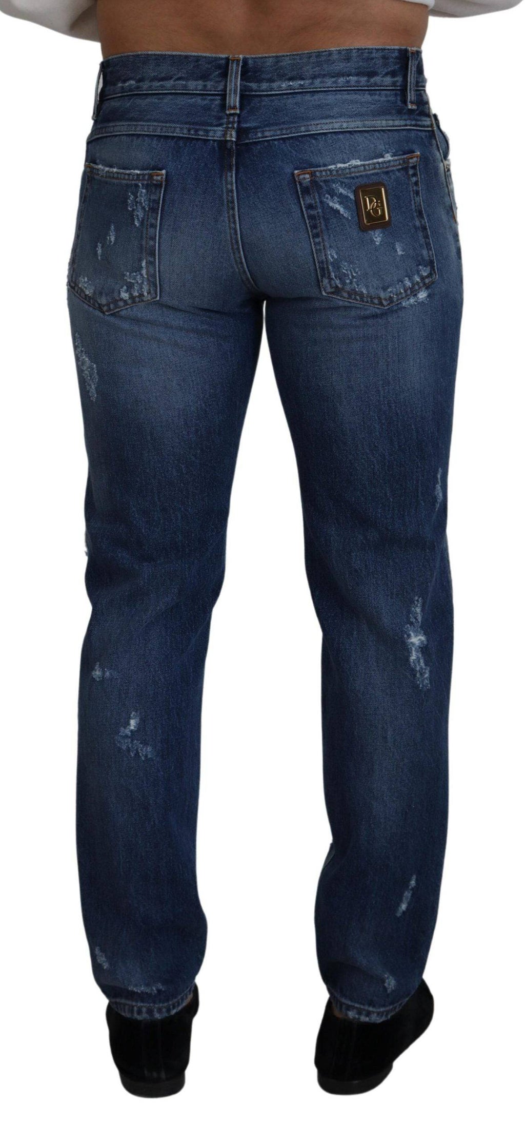 Jeans pour homme en denim bleu tacheté de Dolce & Gabbana, en coton, avec un style déchiré et déchiré.