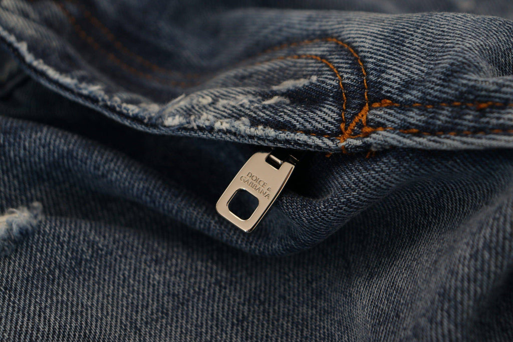 Jeans déchirés en coton bleu de Dolce & Gabbana pour homme, style décontracté et tendance.