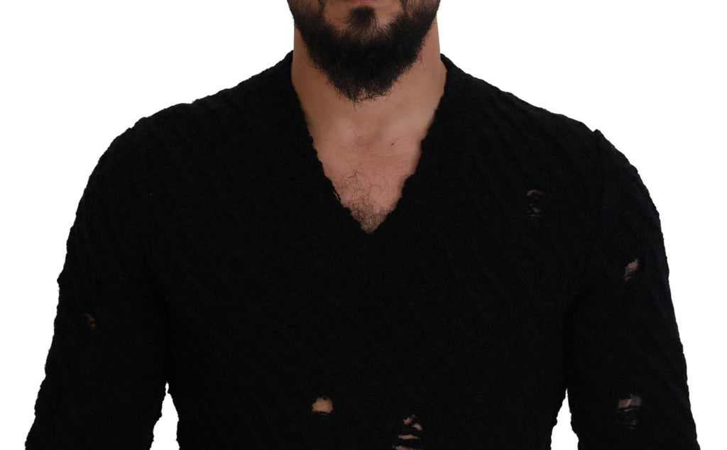 Pull en laine noir Dolce & Gabbana avec col en V, style tricoté, visible en détail dans l'image.