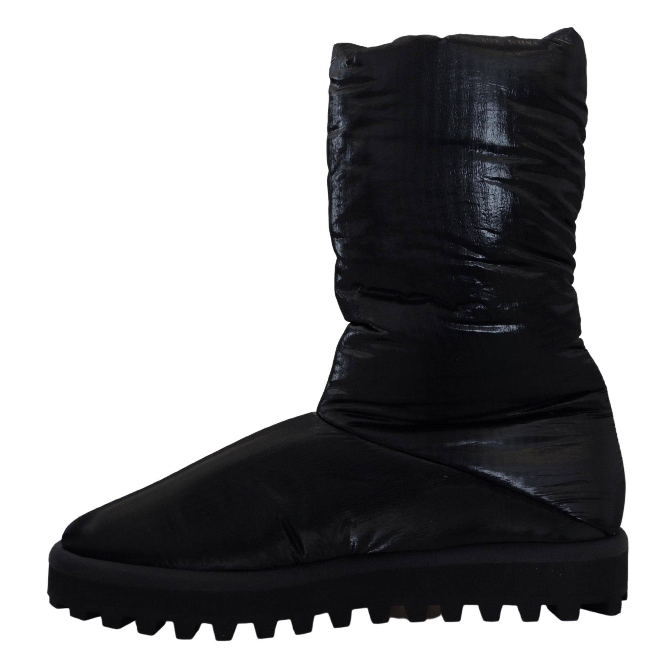 Bottes noires Dolce & Gabbana en duvet, mi-mollet, parfaites pour l'hiver, avec semelle robuste et design élégant.