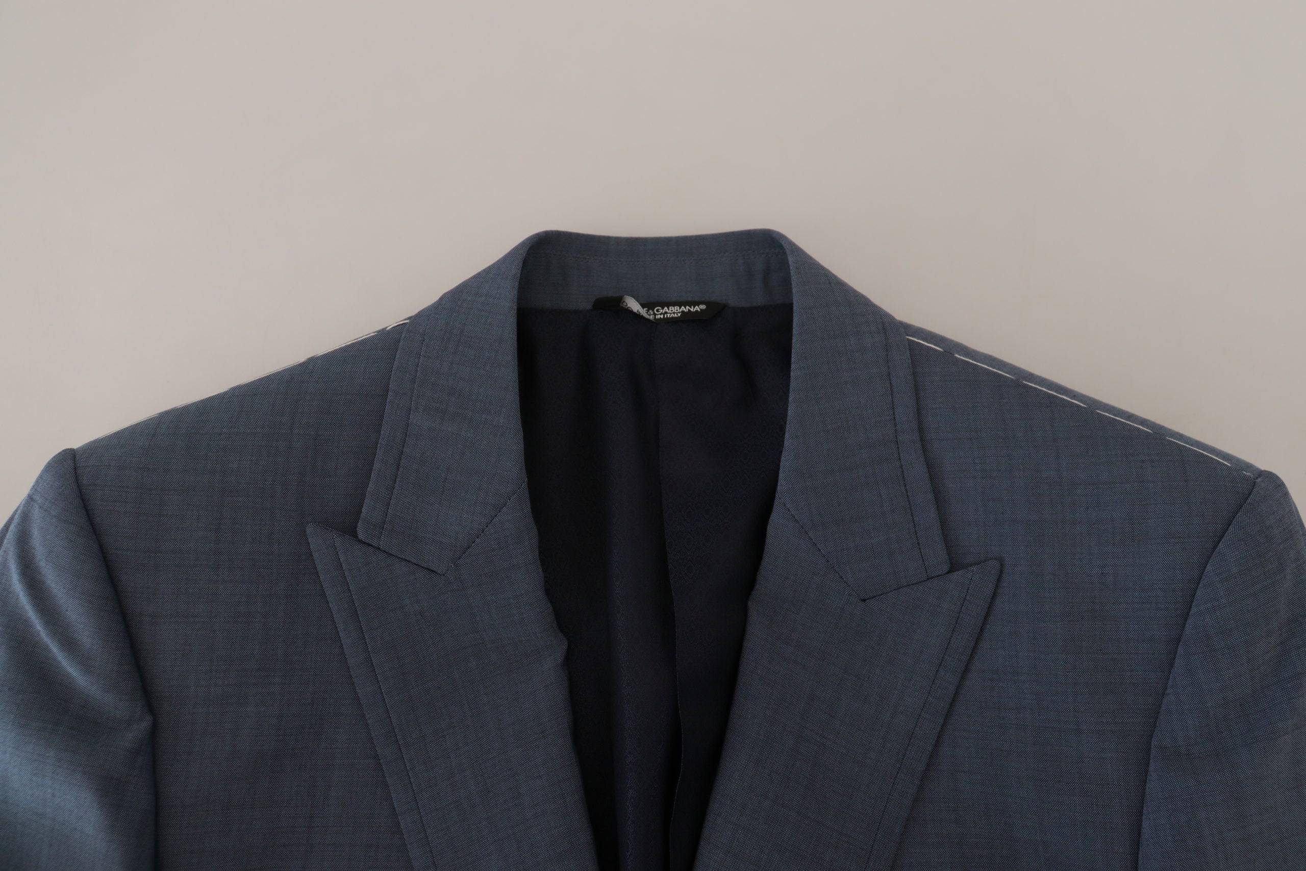 Veste blazer slim fit en laine bleue Dolce & Gabbana, coupe ajustée et élégante, vue de face sur un fond neutre.