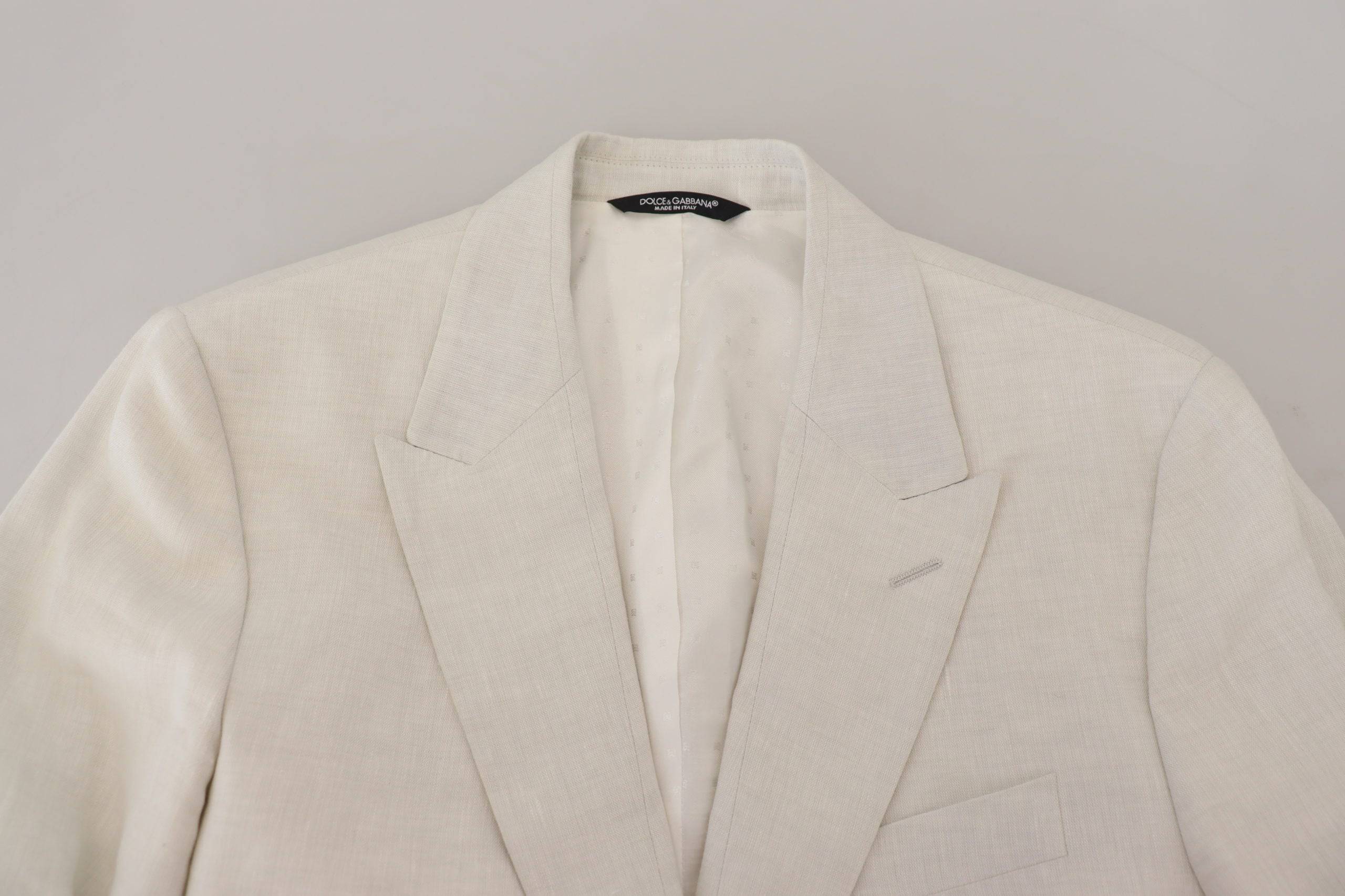 Veste blazer blanche en lin Dolce & Gabbana, coupe slim fit, élégante avec détails sophistiqués et finition soignée.