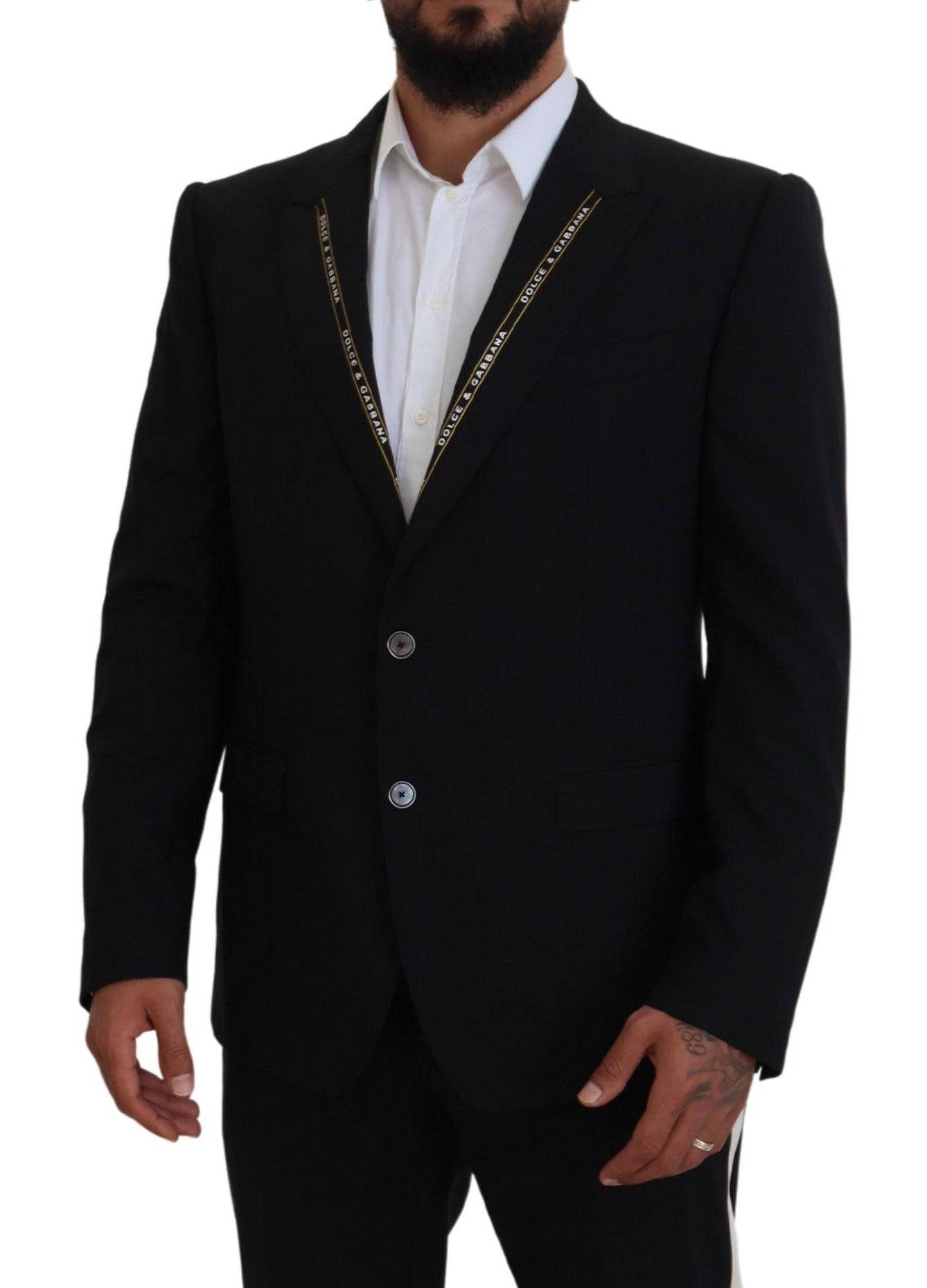 Veste blazer noire en laine stretch Dolce & Gabbana, coupe slim fit, élégante et élégante, visible sur le mannequin.