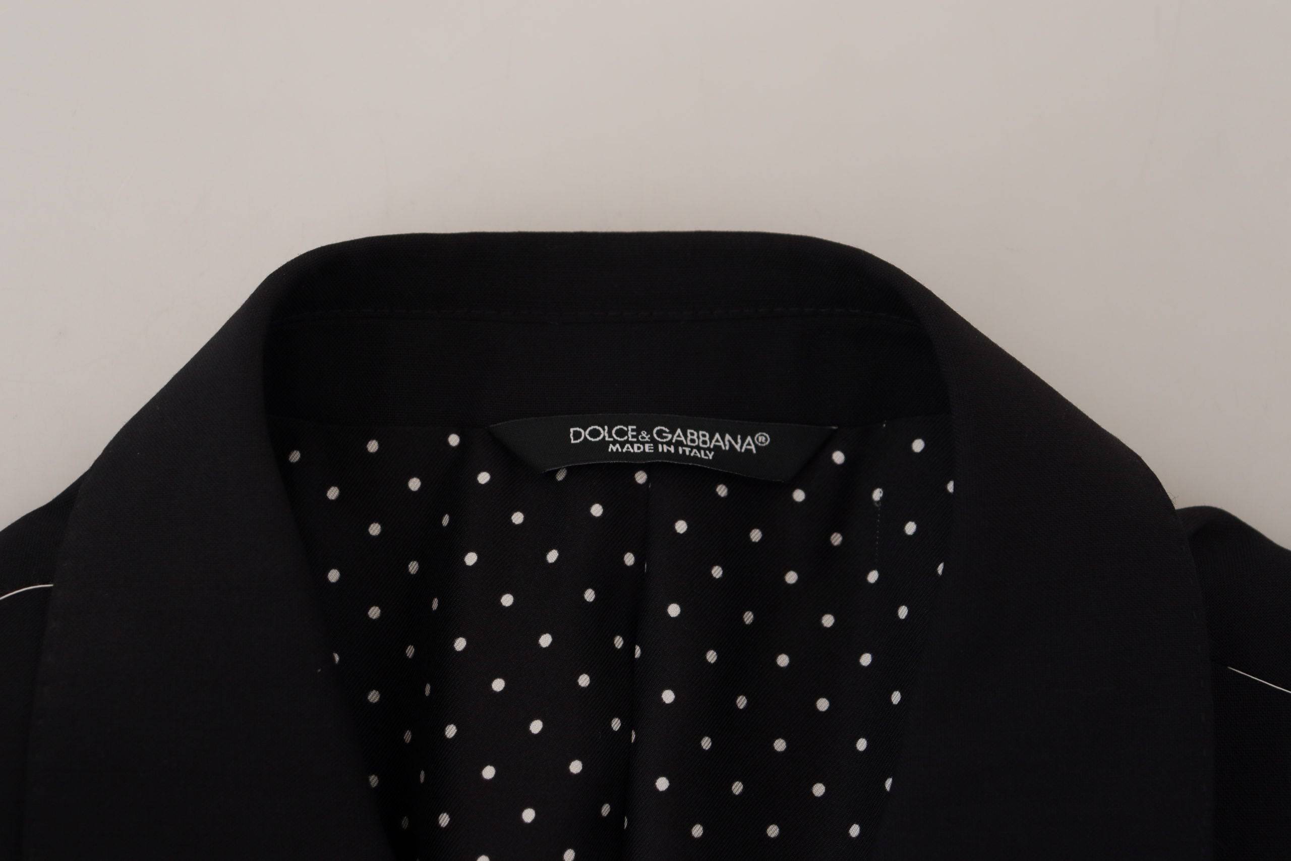 Veste blazer noire en laine stretch Dolce & Gabbana, coupe slim fit, élégante et moderne, portée sur un mannequin.