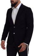 Blazer slim fit en laine noire de Dolce & Gabbana avec détail de couronne sur le col, mode élégante et sophistiquée.