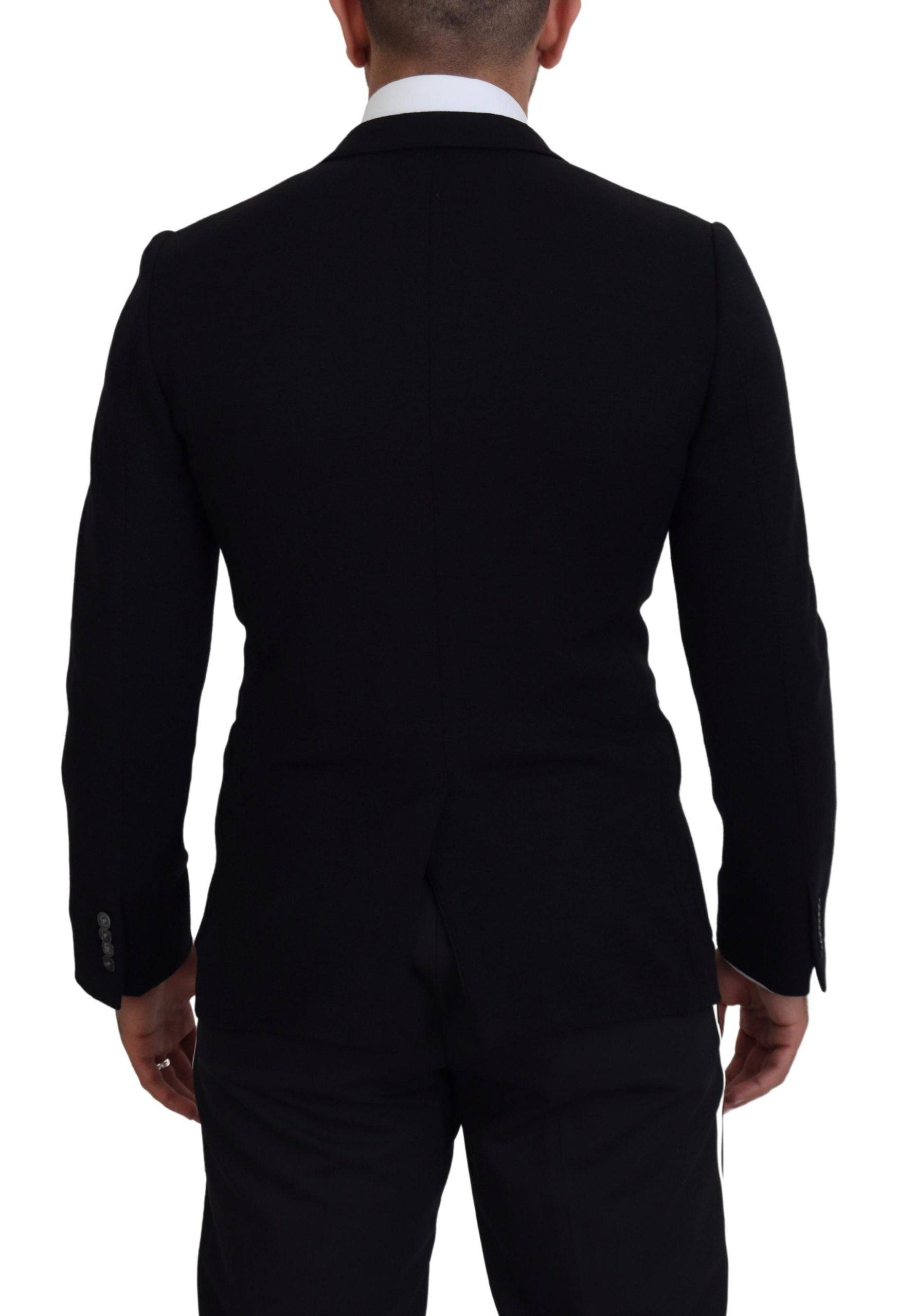 Veste blazer slim fit en laine noire de Dolce & Gabbana, avec une coupe élégante et une couronne comme détail de design.