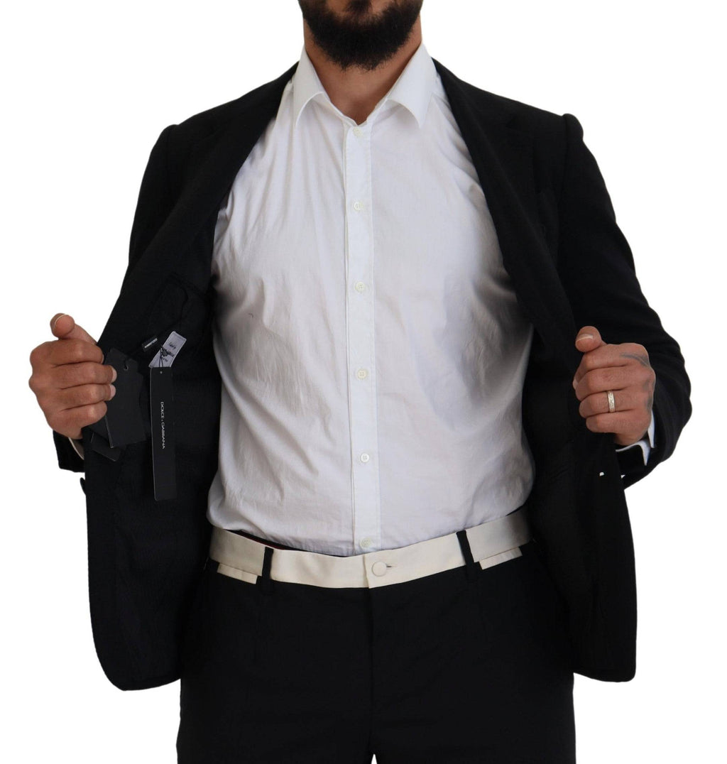 Veste blazer noire en laine Dolce & Gabbana avec coupe slim fit et design couronne, pour un look chic et élégant.