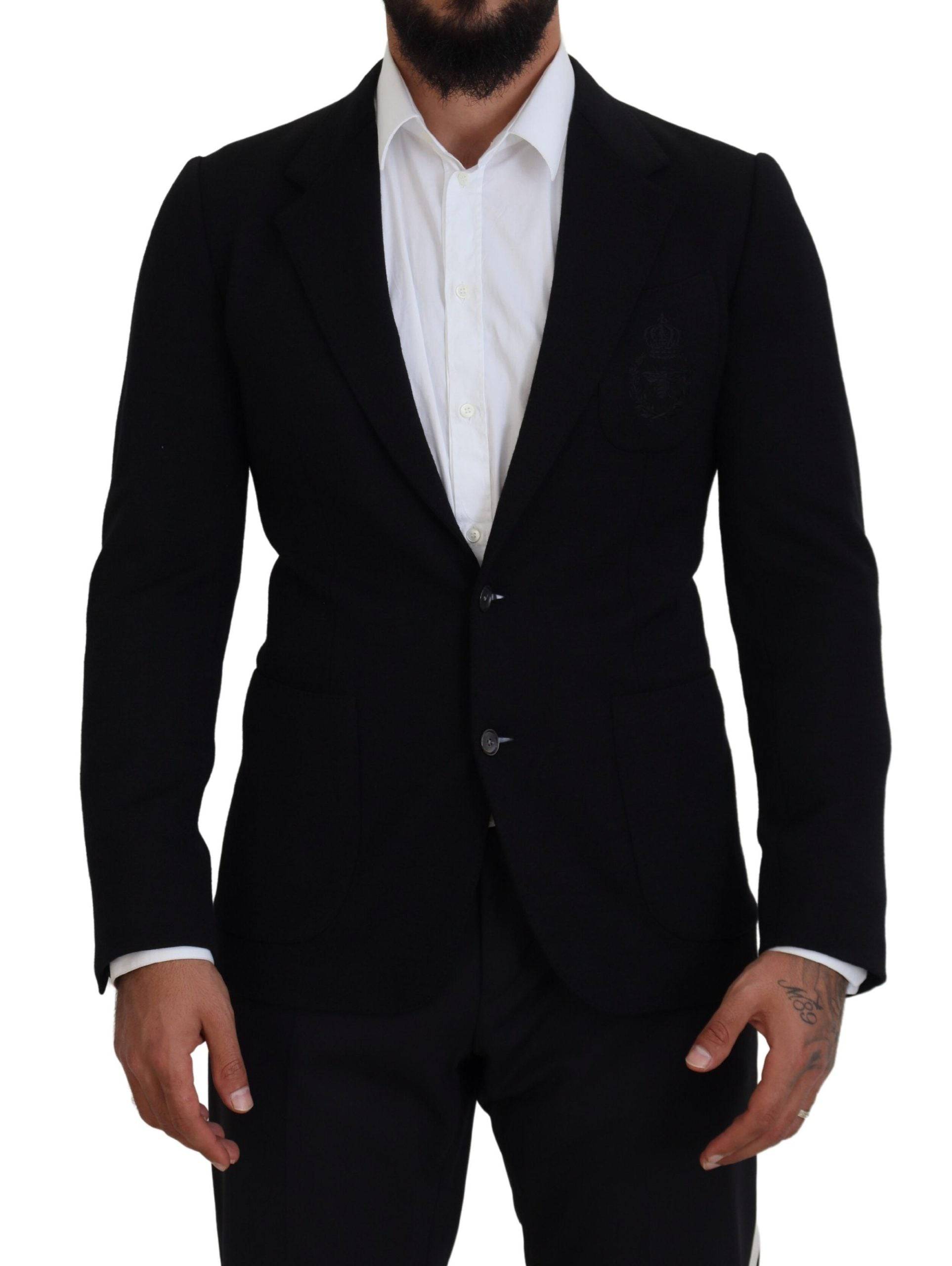 Veste blazer noire en laine Dolce & Gabbana, coupe slim, avec col en forme de couronne, détails élégants et ajustés.