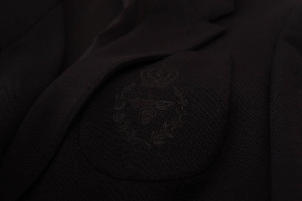 Veste blazer noire en laine Dolce & Gabbana, coupe slim, avec col en forme de couronne, pour un style élégant et sophistiqué.