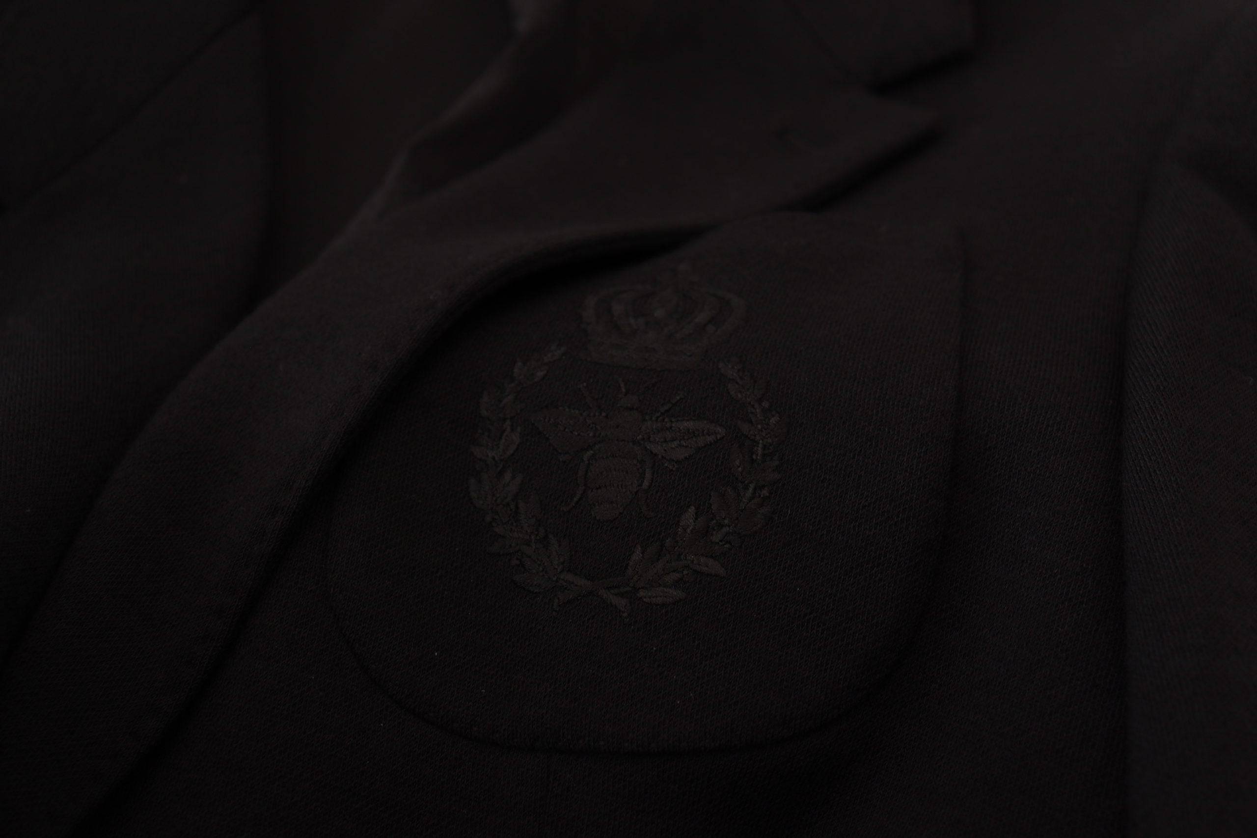 Veste blazer noire en laine Dolce & Gabbana, coupe slim, avec col en forme de couronne, pour un style élégant et sophistiqué.