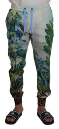Pantalon jogging homme Dolce & Gabbana blanc avec imprimé floral, style décontracté et confortable, vue de l'avant sur fond neutre.