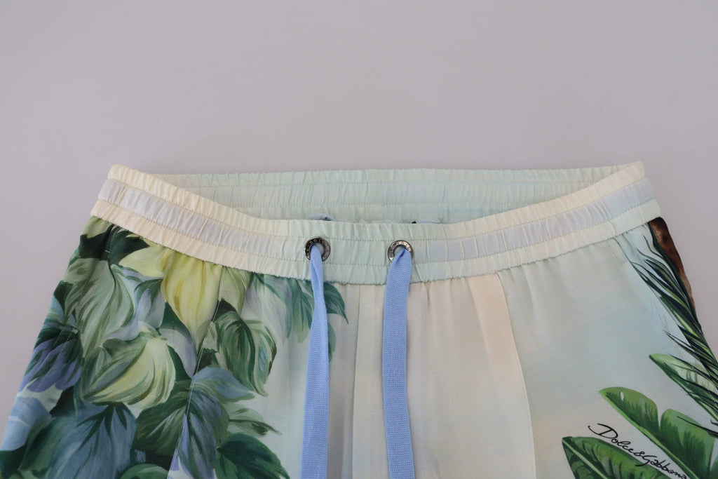 Pantalon jogging homme blanc à fleurs Dolce & Gabbana avec motif floral, tissu léger et ajustement confortable.