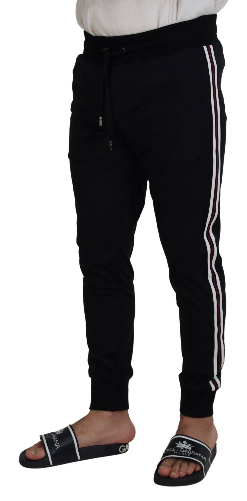 Pantalon jogger pour homme Dolce & Gabbana noir avec motif DG, tissu confortable et style décontracté.