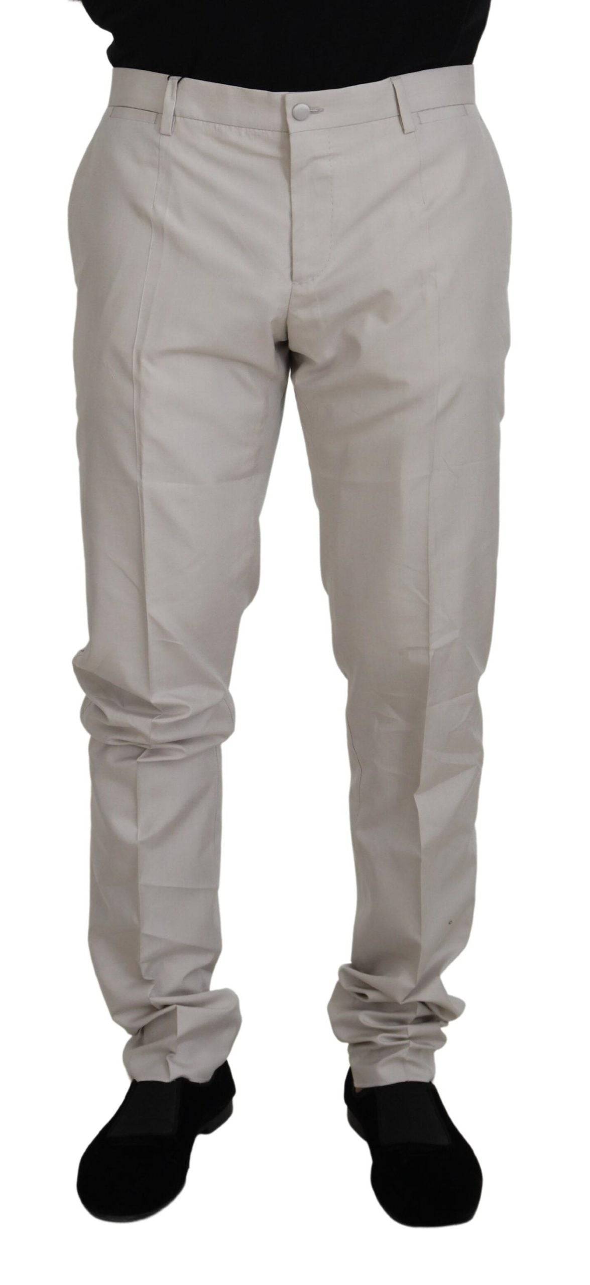 Pantalons chino en soie blanche à taille moyenne Dolce & Gabbana, style élégant et tissu léger visible sur l'image.