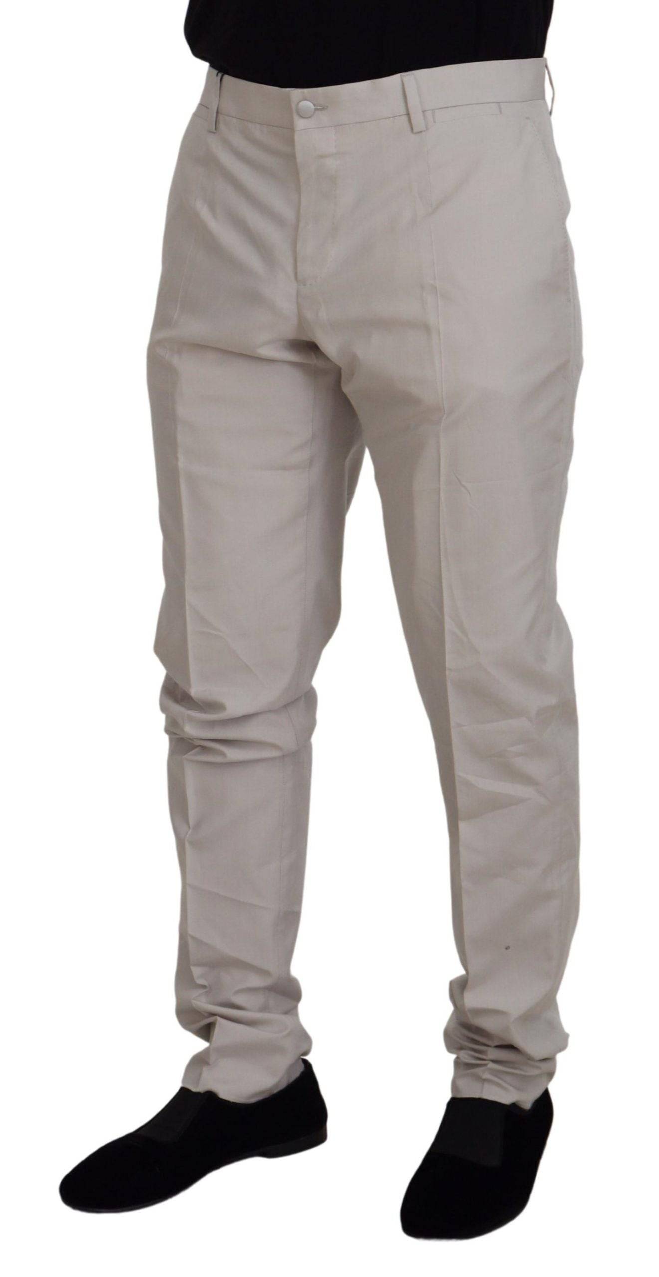 Pantalons chino en soie blanche Dolce & Gabbana taille moyenne, style élégant et tissu léger visible sur cette image.