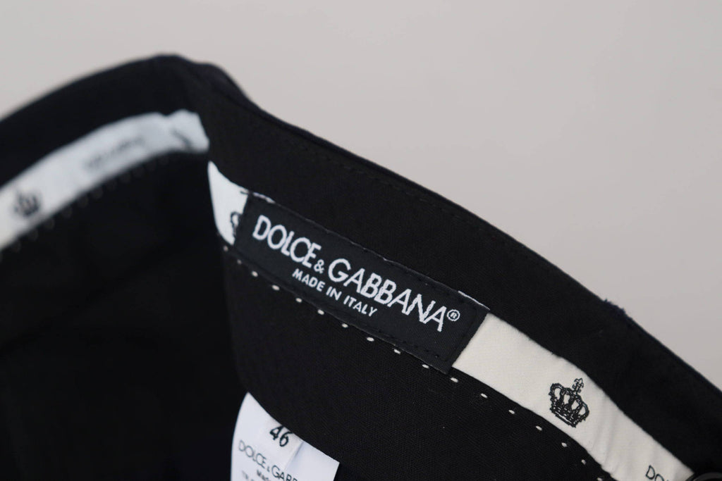 Pantalon de costume noir en laine Dolce & Gabbana, coupe slim, élégant et formel, visible en détail sur l'image.