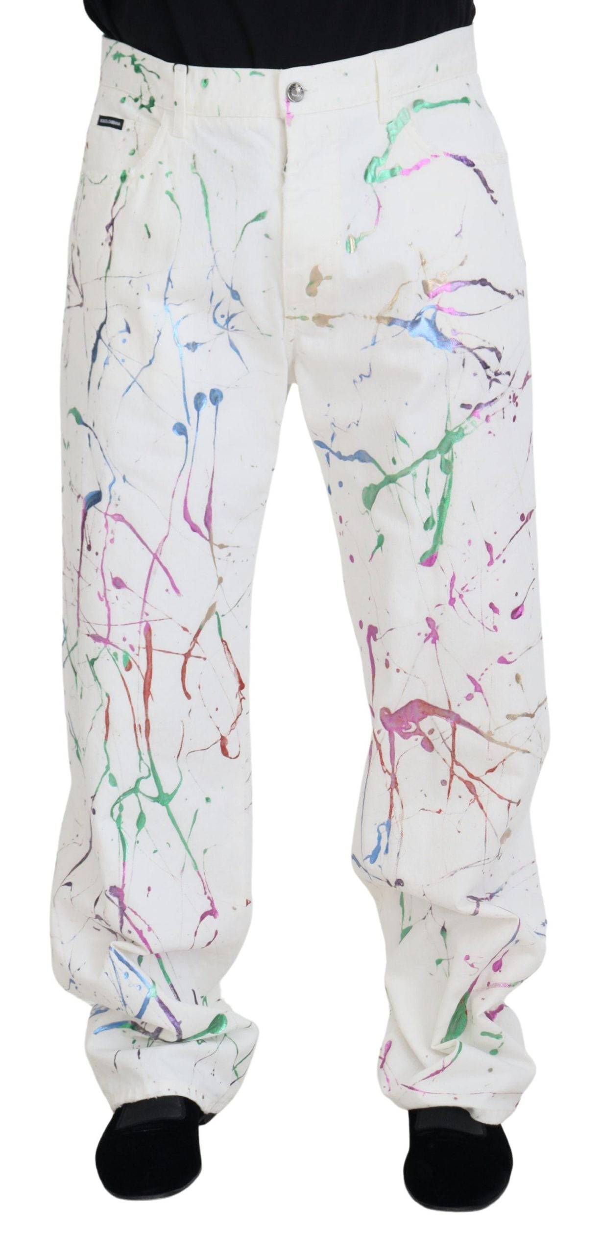 Pantalons en denim blanc Dolce & Gabbana avec impression colorée, coton et coupe classique visible sur l'image.
