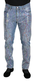 Jeans en denim bleu Dolce & Gabbana avec imprimé éclaboussure de couleurs, coupe classique et détails modernes.