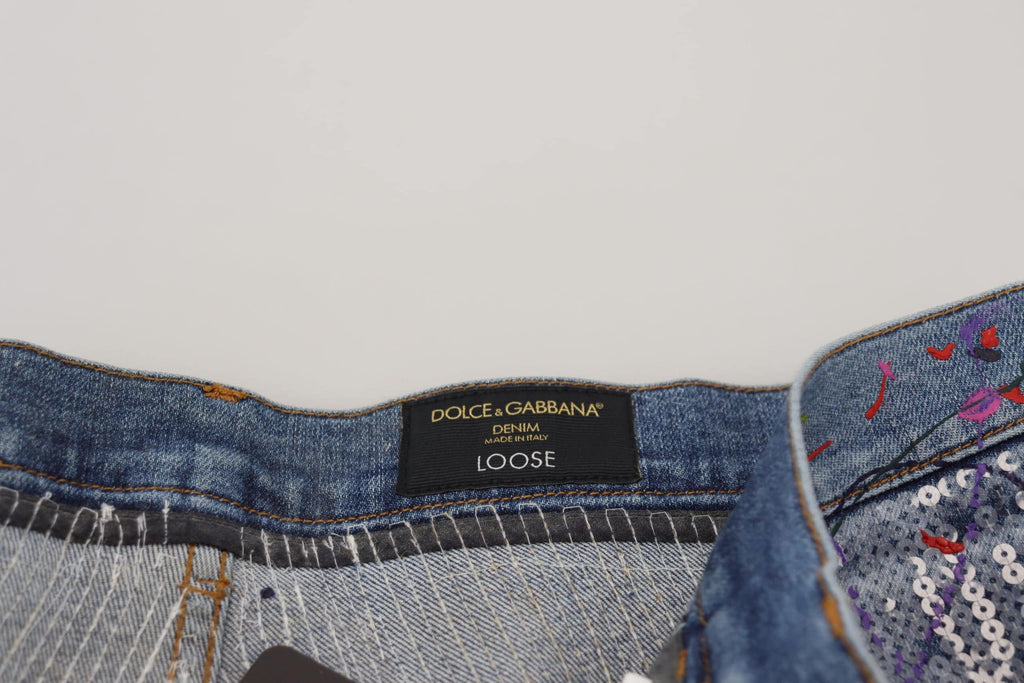 Jeans en denim bleu Dolce & Gabbana avec impression colorée en coton, style décontracté et tendance.