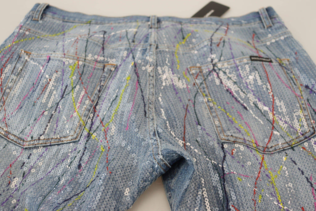 Jeans en denim bleu Dolce & Gabbana avec motif coloré, coupe classique et détails en coton.
