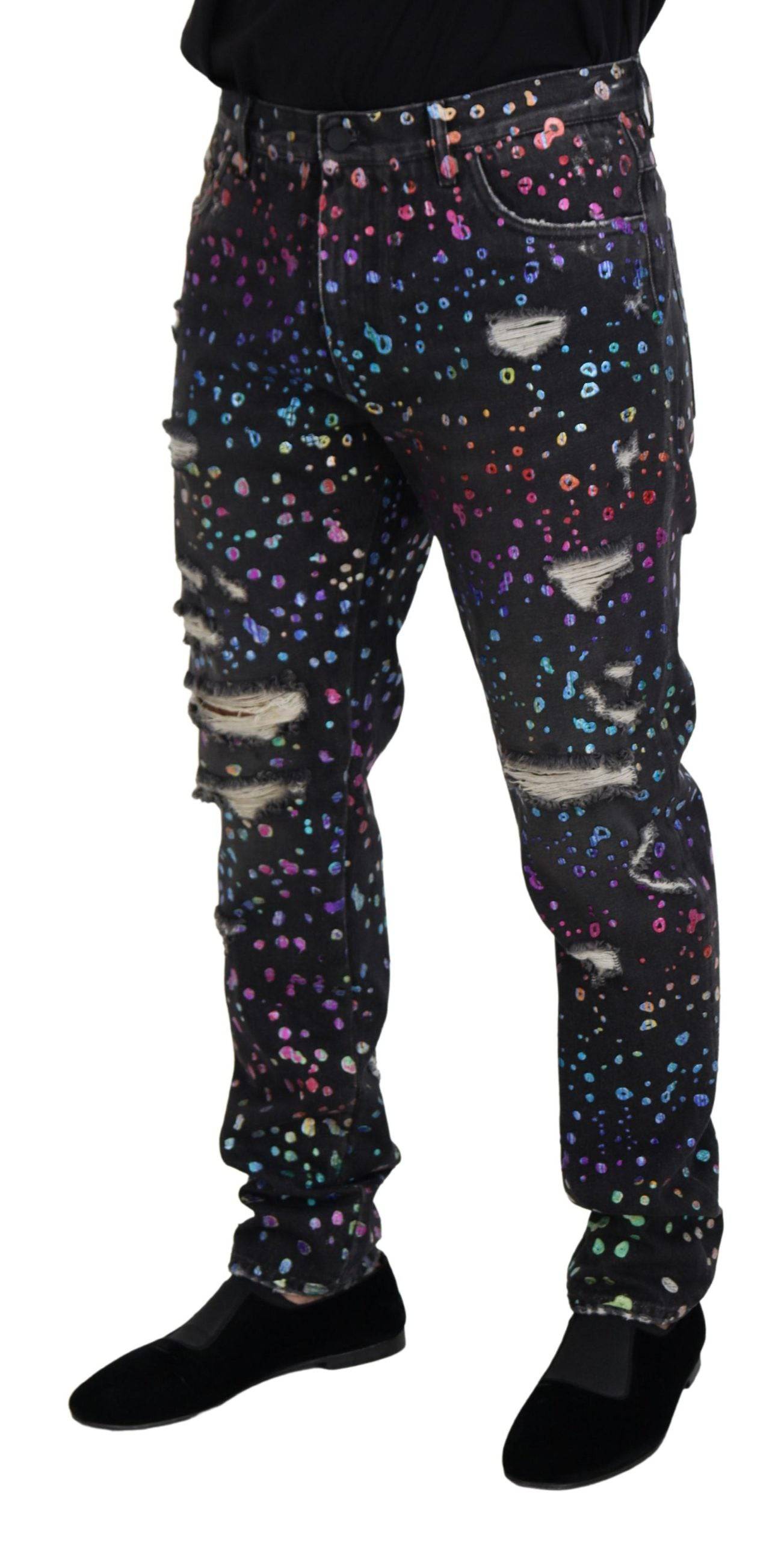 Jeans en denim déchiré Dolce & Gabbana à motif multicolore noir, style tattered, vue de face.