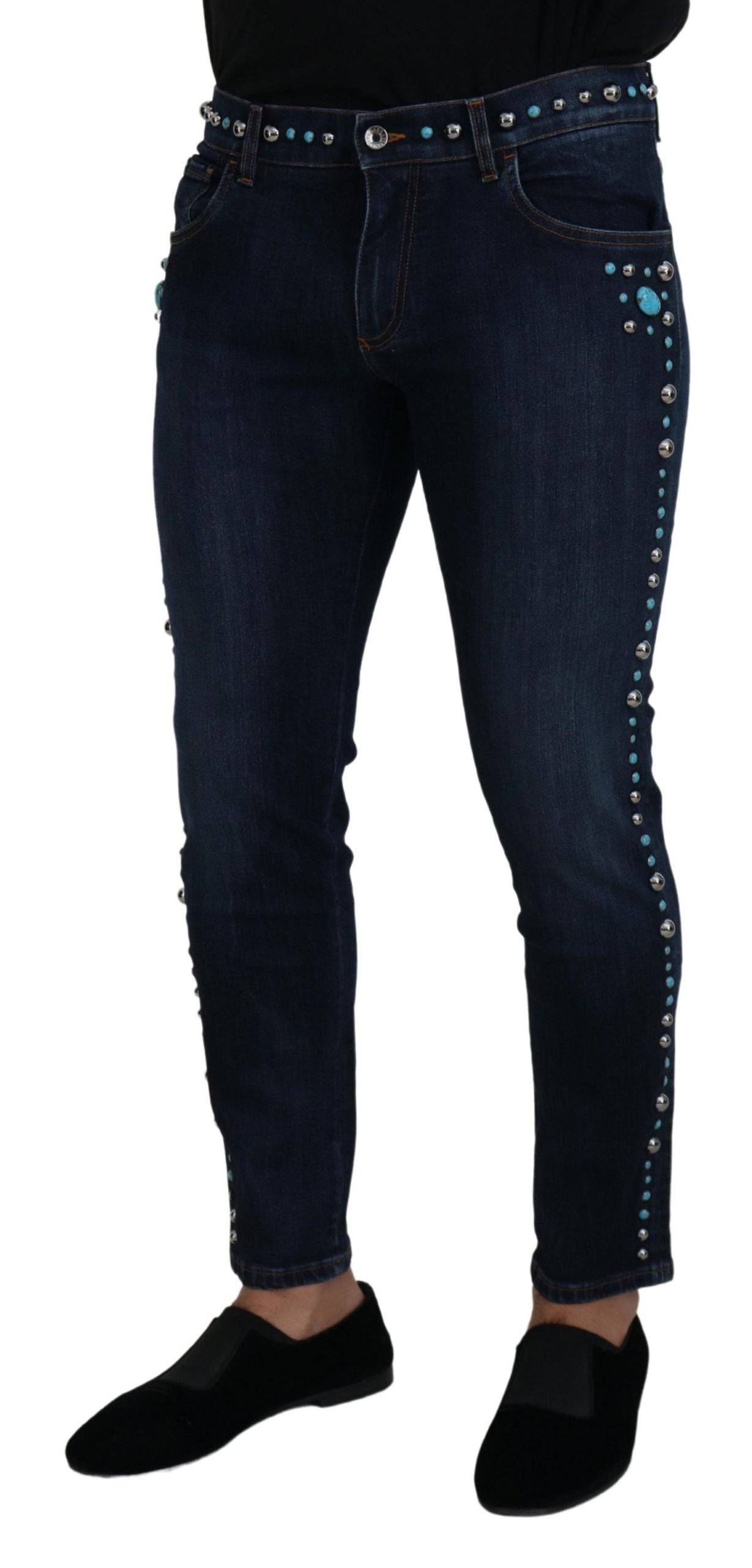 Jeans en denim bleu Dolce & Gabbana à taille basse avec studs, en coton, style décontracté et tendance.