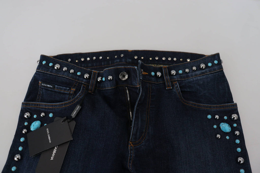 Jeans en denim bleu Dolce & Gabbana, taille basse, avec des studs en coton, style décontracté et tendance.