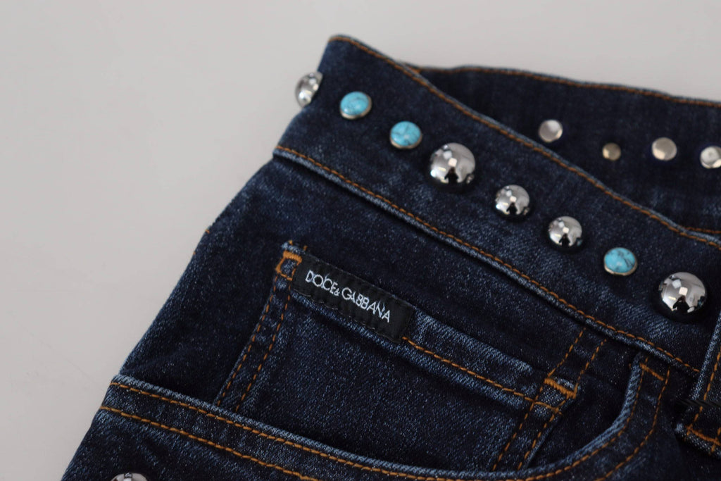 Jeans en denim bleu Dolce & Gabbana avec studs, taille basse, en coton, visible sur l'image.