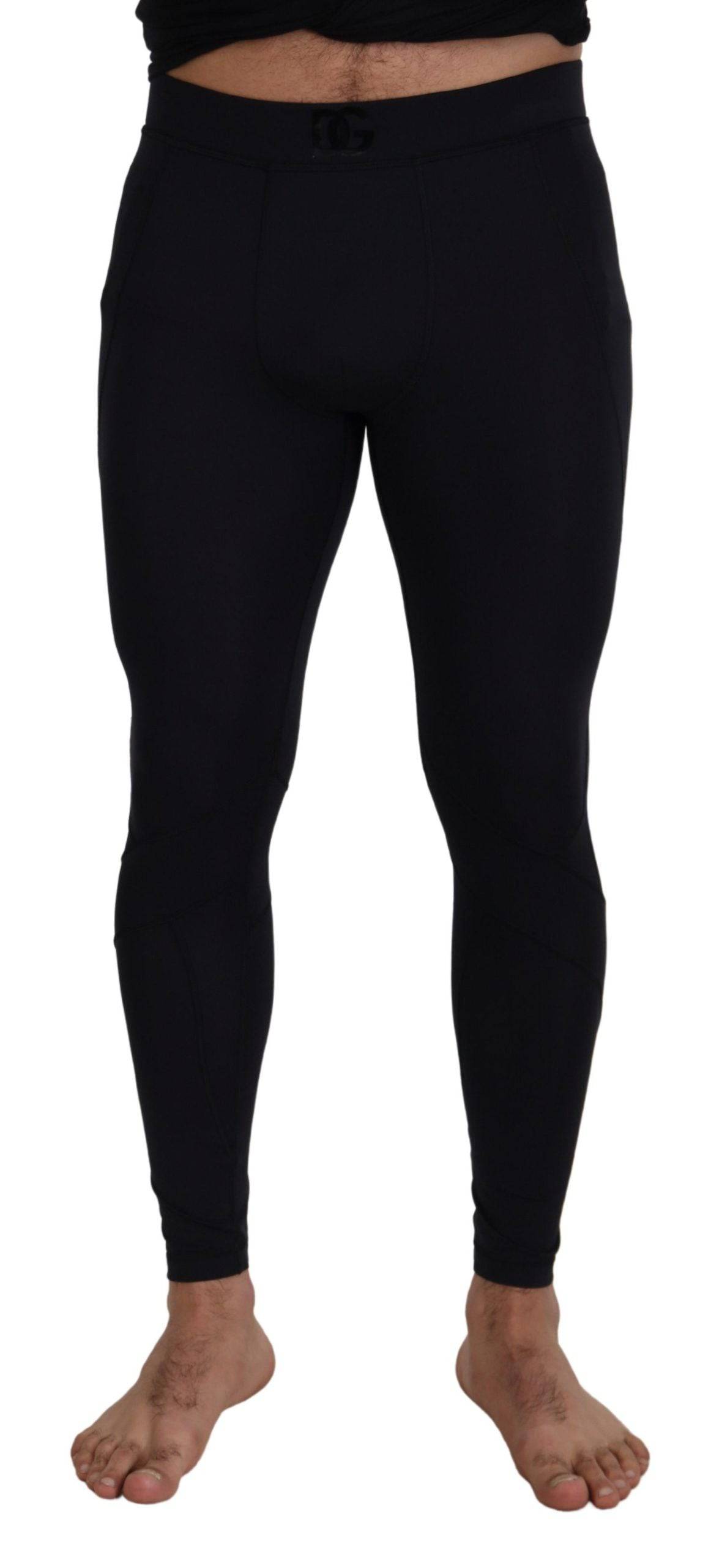 Pantalon noir en nylon extensible Dolce & Gabbana, coupe slim, pour homme, visible en détail dans l'image.