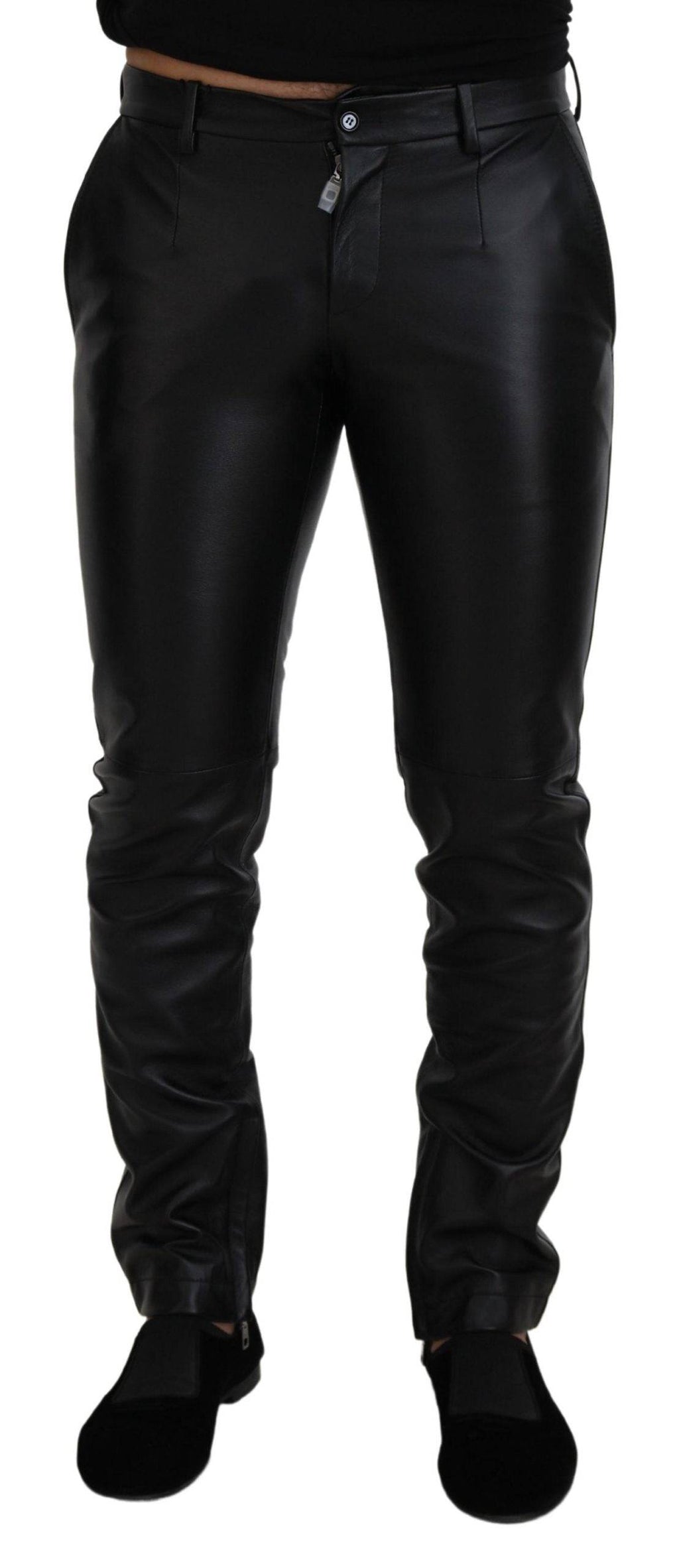 Pantalon skinny noir brillant en stretch de la marque Dolce & Gabbana, ajusté et élégant, visible sur l'image.