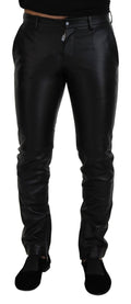 Pantalon skinny noir brillant en stretch de la marque Dolce & Gabbana, ajusté et élégant, visible sur l'image.