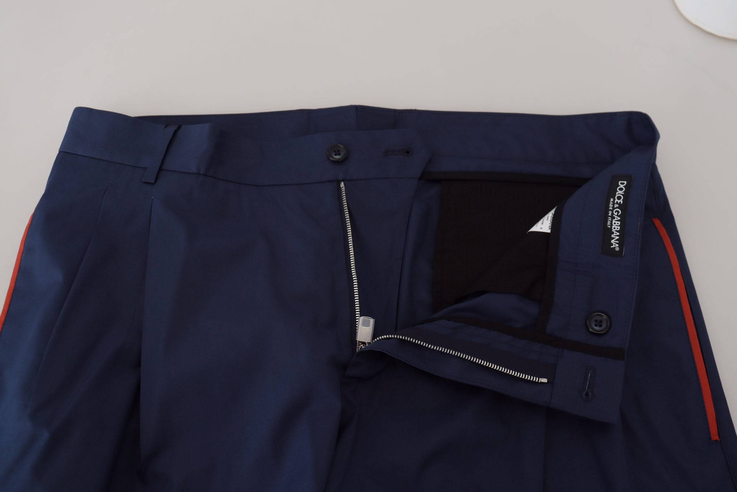 Pantalons chics Dolce & Gabbana en coton bleu, style formel chino pour homme, avec coupe élégante et détails soignés.