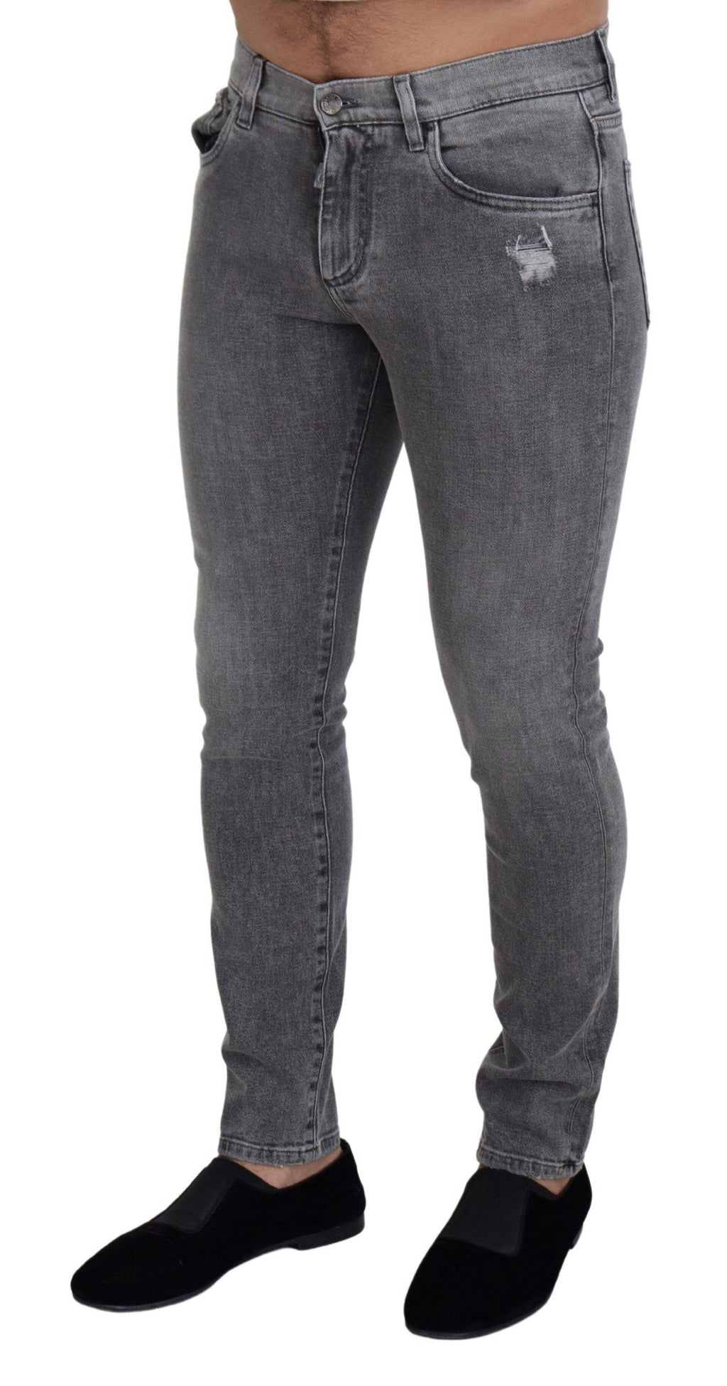 Jeans skinny en denim gris délavé de Dolce & Gabbana en coton, ajustés et modernes, visibles sur l'image.