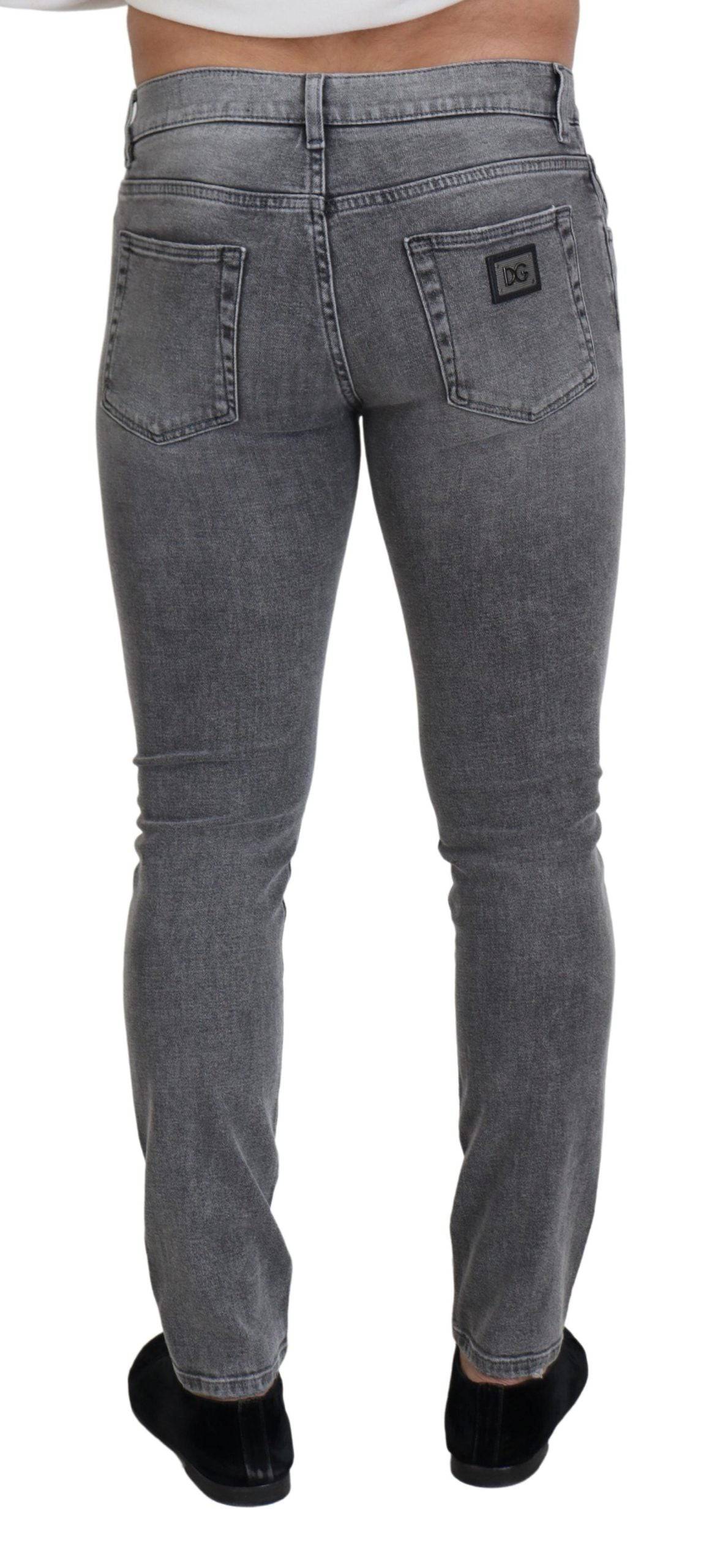 Jeans skinny en denim gris délavé Dolce & Gabbana en coton, vue de face avec détails de couture et coupe ajustée.