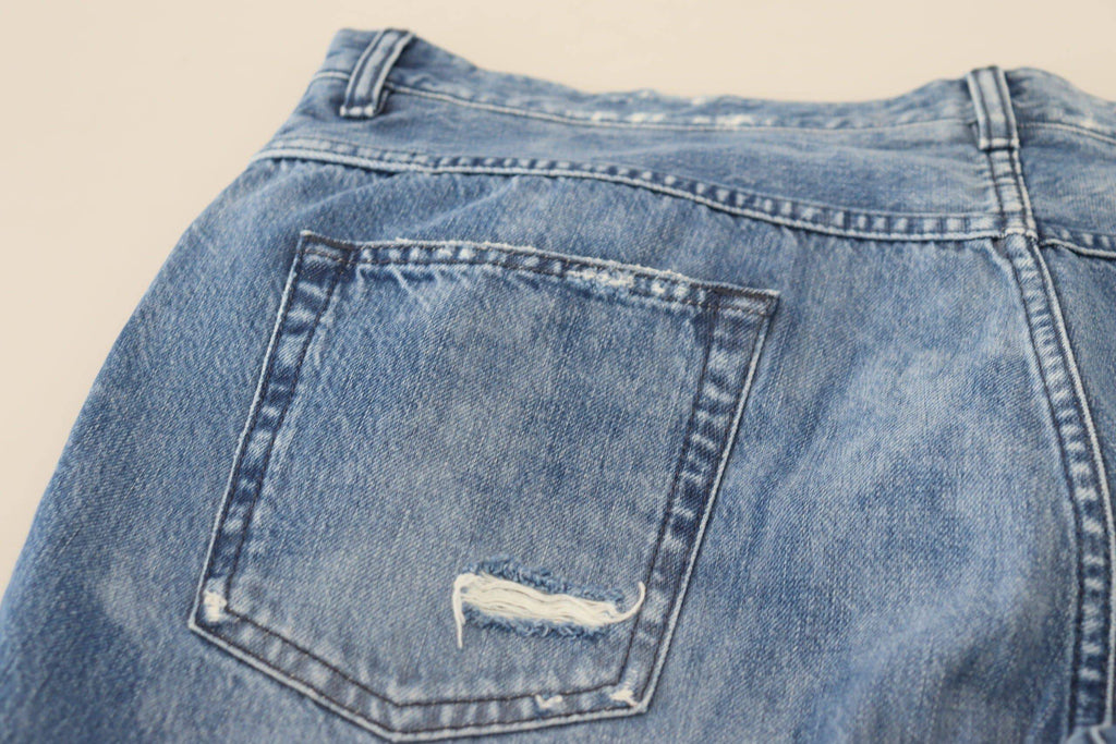 Jeans décontractés en denim bleu en coton lavé de Dolce & Gabbana, coupe classique et détails modernes.