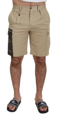 Shorts cargo beige en coton de Dolce & Gabbana, bermuda décontracté avec poches latérales et ceinture ajustable.