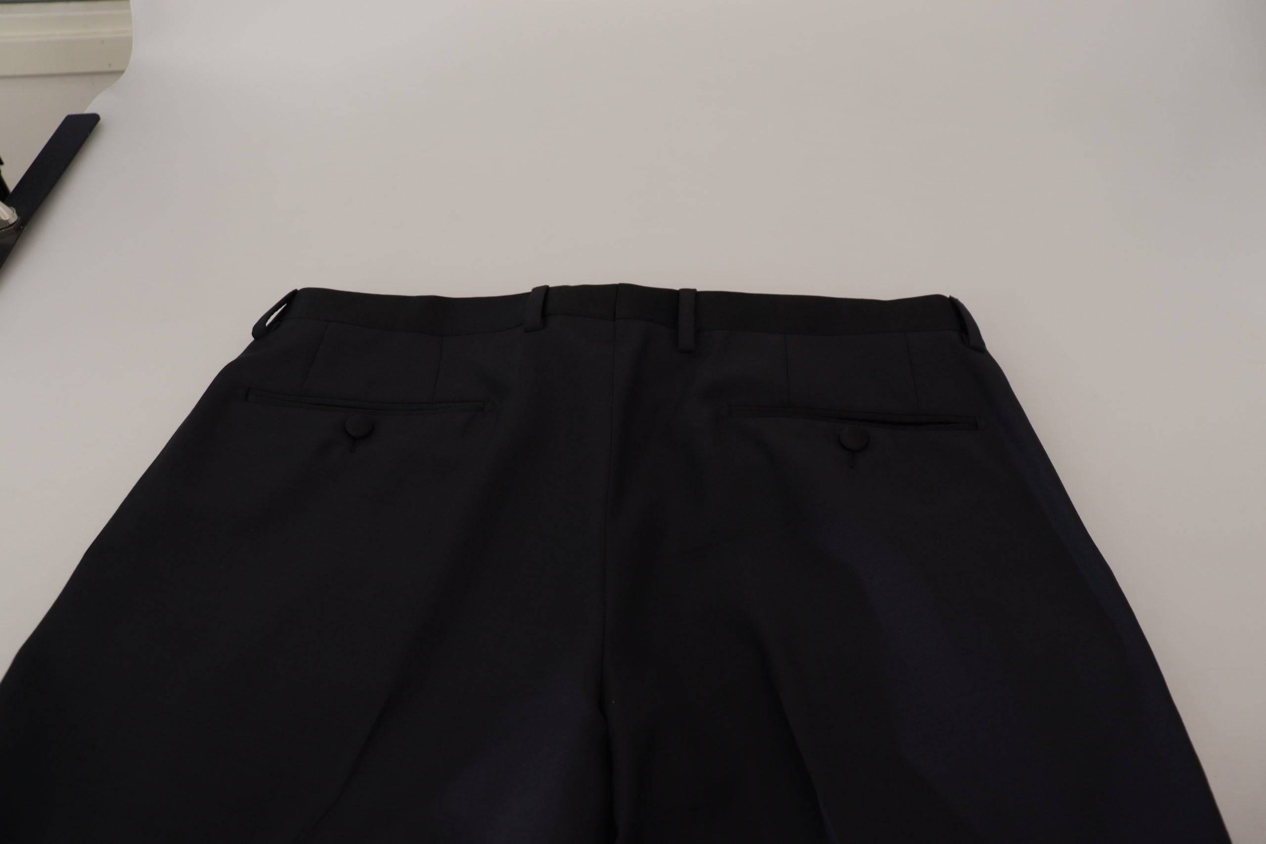 Pantalons formels en laine noire pour homme de Dolce & Gabbana, élégants et classiques, visibles en gros plan.
