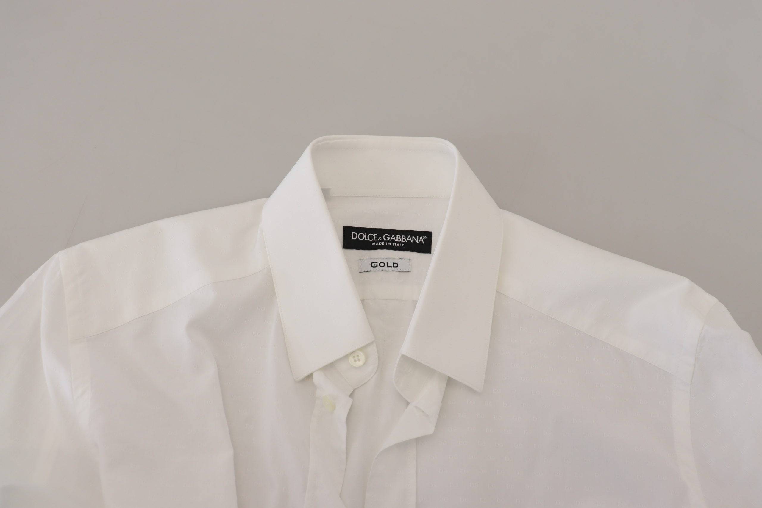 Chemise formelle blanche en coton Dolce & Gabbana, coupe slim, avec détails dorés visible sur l'image.