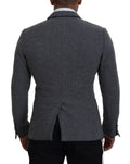 Veste blazer gris en laine Dolce & Gabbana avec motifs roses, coupe slim fit, élégante et sophistiquée.